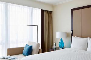 Postel nebo postele na pokoji v ubytování London Marriott Hotel Canary Wharf