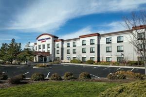 a rendering of a hotel with a parking lot at SpringHill Suites by Marriott Medford in Medford