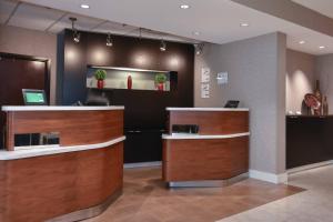 a lobby of a salon with a reception desk at Courtyard by Marriott Charlotte Lake Norman in Huntersville