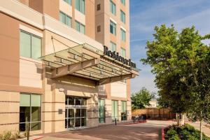 a building with a balcony on the side of it at Residence Inn by Marriott Houston Medical Center/NRG Park in Houston