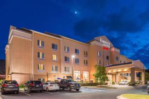 a hotel with cars parked in a parking lot at Fairfield Inn and Suites by Marriott Birmingham Pelham/I-65 in Pelham