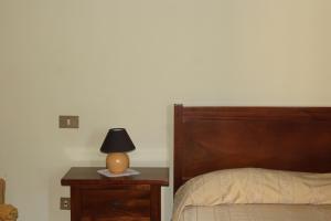 Postel nebo postele na pokoji v ubytování B&B Palazzo Pancaro
