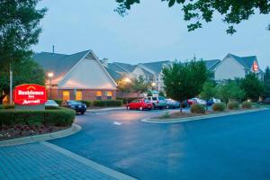 a parking lot with a sign in front of a building at Residence Inn by Marriott Lake Norman in Huntersville