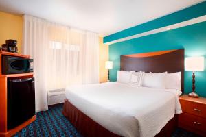 a hotel room with a large bed and a television at Sonesta Essential Houston Energy Corridor in Houston +14 photos