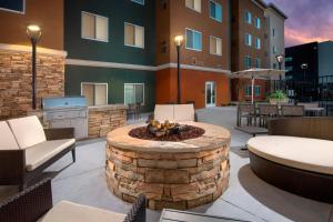 a patio with a fire pit in front of a building at Residence Inn by Marriott Lubbock Southwest in Lubbock