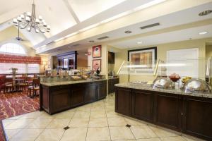 a large kitchen with counters and a dining room at Residence Inn by Marriott Albuquerque North in Albuquerque