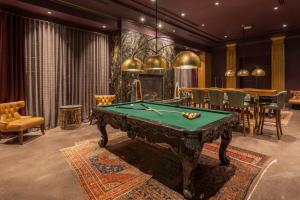 a billiard room with a pool table at Grand Bohemian Hotel Mountain Brook, Autograph Collection in Birmingham