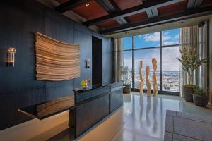 a living room with a view of the city at AC Hotel by Marriott Downtown Los Angeles in Los Angeles