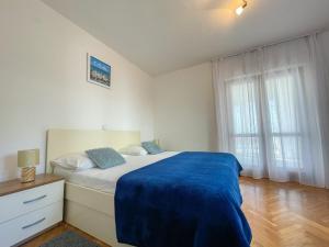 Łóżko lub łóżka w pokoju w obiekcie Apartments Marija Magdalena