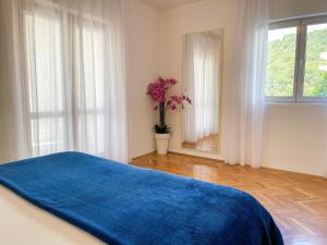 Łóżko lub łóżka w pokoju w obiekcie Apartments Marija Magdalena