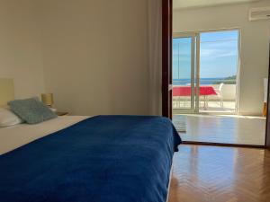 Łóżko lub łóżka w pokoju w obiekcie Apartments Marija Magdalena