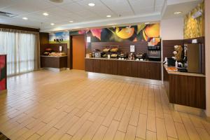 a lobby of a restaurant with a food counter at Fairfield Inn & Suites by Marriott Dover in Dover