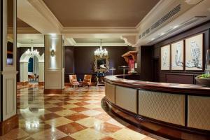 a lobby with a bar in a building at Bristol Marriott Royal Hotel in Bristol