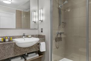 a bathroom with a sink and a shower at Bristol Marriott Royal Hotel in Bristol