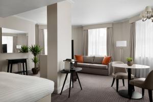 a hotel room with a bed and a couch at Bristol Marriott Royal Hotel in Bristol