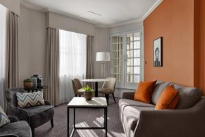 a living room with a couch and a table at Bristol Marriott Royal Hotel in Bristol