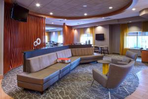 a lobby with a couch and chairs and a bar at Springhill Suites by Marriott Frankenmuth in Frankenmuth