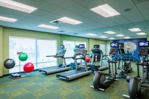 a gym with treadmills and ellipticals in a room at SpringHill Suites by Marriott Kennewick Tri-Cities in Kennewick