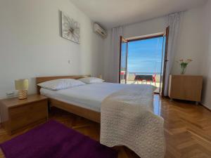 Łóżko lub łóżka w pokoju w obiekcie Apartments Marija Magdalena