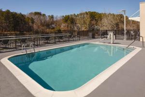 a large swimming pool with a blue at Fairfield Inn & Suites Seneca Clemson Univ Area in Seneca