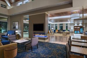 a lobby with a fireplace in a hotel at TownePlace Suites by Marriott San Diego Airport/Liberty Station in San Diego