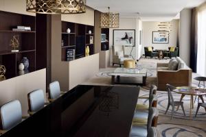 a living room with a couch and a table at Marriott Executive Apartments Downtown, Abu Dhabi in Abu Dhabi