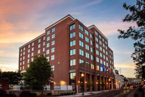 a tall red brick building on a city street at Residence Inn by Marriott Norwalk in Norwalk