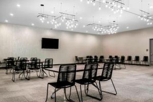 a conference room with a long table and chairs at Aloft Newport on the Levee in Newport