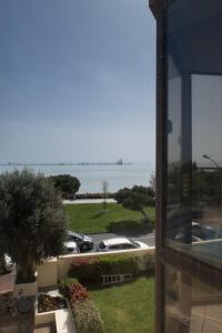 a view of a parking lot from a building at Logis Hôtel Le Rochelois in La Rochelle