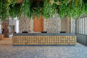 a bench in the middle of a building at W Costa Navarino in Pylos