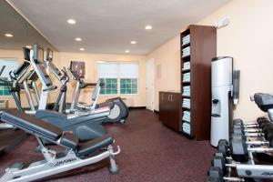 a gym with treadmills and ellipticals in a room at TownePlace Suites by Marriott Indianapolis - Keystone in Indianapolis