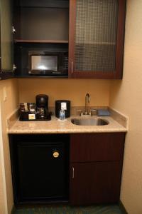 a kitchen with a sink and a microwave at SpringHill Suites Morgantown in Morgantown