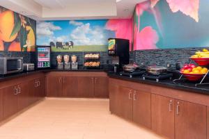 a kitchen with a counter with food on it at Fairfield Inn & Suites by Marriott Galesburg in Galesburg