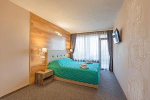 TV a/nebo společenská místnost v ubytování Lecardo Hotel