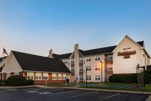 a hotel with a sign on the side of a building at Residence Inn by Marriott Evansville East in Evansville