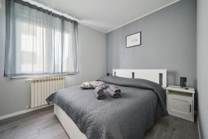 Ein Bett oder Betten in einem Zimmer der Unterkunft Alto Apartments