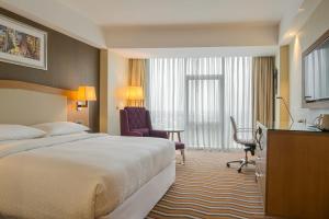 Ένα ή περισσότερα κρεβάτια σε δωμάτιο στο Four Points by Sheraton Ikot Ekpene