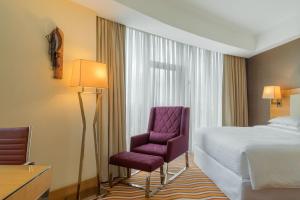 Ένα ή περισσότερα κρεβάτια σε δωμάτιο στο Four Points by Sheraton Ikot Ekpene