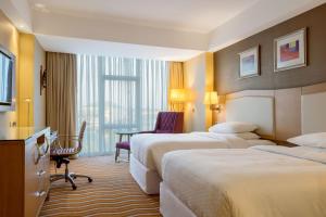 Ένα ή περισσότερα κρεβάτια σε δωμάτιο στο Four Points by Sheraton Ikot Ekpene