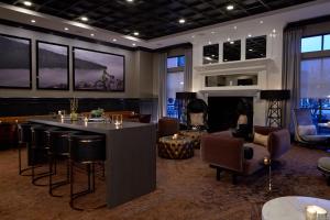 a lobby with a bar and a living room with a fireplace at Residence Inn Minneapolis Downtown at The Depot in Minneapolis