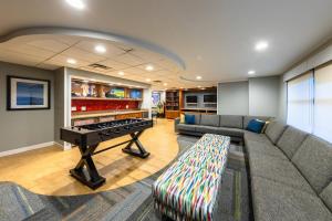 a living room with a couch and a piano at Marriott's Timber Lodge in South Lake Tahoe