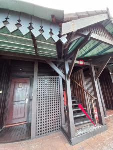 a building with a red door and a red door at Langkawi Lagoon Hotel Resort in Kampung Padang Masirat