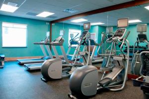 a gym with several tread machines in a room at Fairfield Inn & Suites by Marriott Des Moines Urbandale in Urbandale