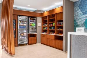 a kitchen with two refrigerators in a restaurant at SpringHill Suites by Marriott Savannah Richmond Hill in Richmond Hill