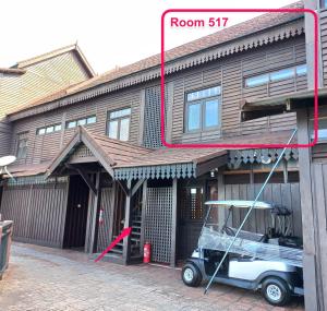 a small car parked in front of a building at Langkawi Lagoon Hotel Resort in Kampung Padang Masirat