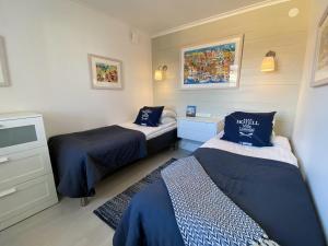 Postel nebo postele na pokoji v ubytování Skaftö Hotell Villa Lönndal, Grundsund