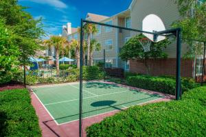 a tennis court in front of a house at Residence Inn by Marriott Pensacola Downtown in Pensacola