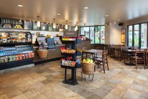 a restaurant with tables and chairs and a store at Marriott's Maui Ocean Club - Molokai, Maui & Lanai Towers in Lahaina