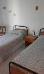 Ένα ή περισσότερα κρεβάτια σε δωμάτιο στο Grado Vacanze