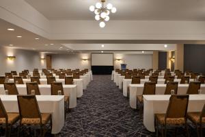 a conference room with rows of tables and chairs at Sheraton Ottawa Hotel in Ottawa